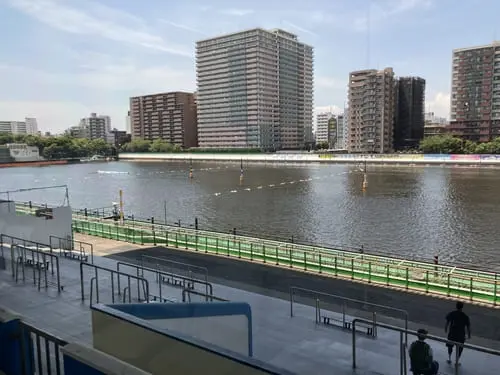 Outdoor seating area at BOAT RACE Heiwajima, offering a close-up view of the water and racecourse with no glass in between.